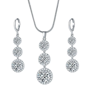 Silver zircon teardrop jewelry set with necklace and drop earrings on white background