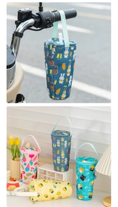 Detail of portable insulated cup sleeves with cartoon prints and handle for outdoor use