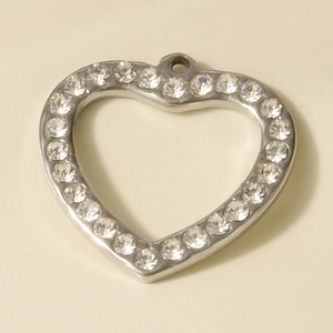 Detailed view of silver heart pendant with sparkling crystals on 304 stainless steel base