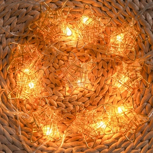 Star-shaped LED fairy lights with golden metal wire for warm Christmas tree decoration