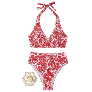Red paisley print two-piece bikini set with high-waisted bottoms and halter top