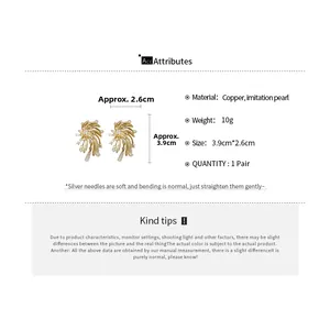 Macro detail of firework star earrings with pearls and crystals measuring 3.9cm by 2.6cm