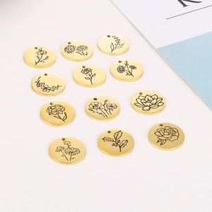 Detailed set of 12 golden stainless steel round pendants with delicate floral engravings