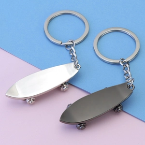 Creative metal finger skateboard keychain pendants in silver and gun grey finishes