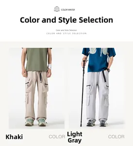Dettaglio dei pantaloni cargo kaki e grigi con tasche multiple e coulisse in vita
