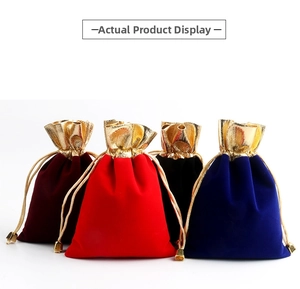 Detail of velvet drawstring jewelry pouches with gold trim in four diverse colors