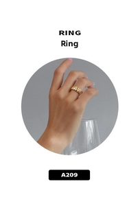 Detail of 18k gold plated wide band ring with textured vertical pleats on a model