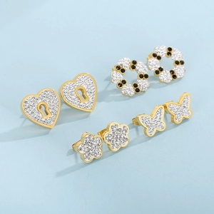 Golden stainless steel stud earring set featuring heart, butterfly, and flower crystal designs