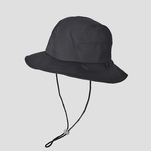 Detail of outdoor hiking bucket hat showing quick-dry fabric and adjustable windproof drawstring