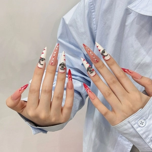 Handmade stiletto press-on nails with red flame art and silver gothic metal charms
