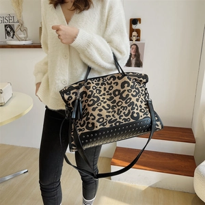 Fashionable leopard print tote bag with silver studs and black fringe tassel charm