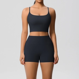 Front view of black breathable yoga set with thin strap sports bra and high waist shorts