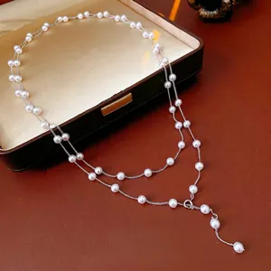 French vintage double-layered pearl necklace with Y-shaped pendant on brown leather