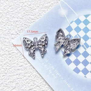 Macro view of blue butterfly alloy pendant with zircon inlays and 17.5mm size markings