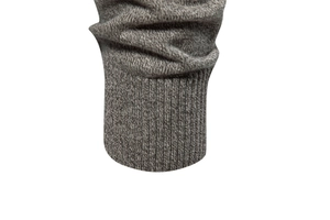 Detail of dark grey ribbed knit cuff on men's sweater featuring high-quality texture