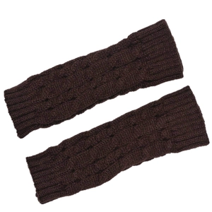 Detailed close-up of dark brown cable knit fingerless gloves showing warm wool texture
