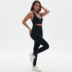 Detail showing high-stretch black seamless fabric and V-neck sports bra craftsmanship