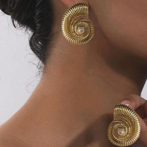 18k gold plated spiral conch earrings with pearl accent on model for retro elegant look