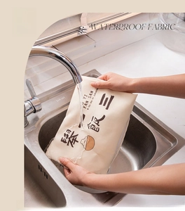 Waterproof fabric detail showing easy cleaning of the beige kitchen apron under running water