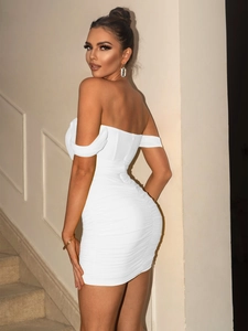 Detailed side view of a white off-shoulder bodycon dress with ruching accents