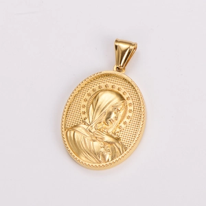 Macro shot of gold vintage oval medallion featuring embossed Virgin Mary pendant detail
