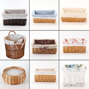 Set of woven rattan storage baskets in various shapes with floral and lace liners