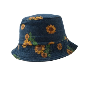 Dark blue baby sun hat with vibrant yellow sunflower prints and soft cotton texture