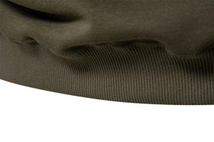 Detail of ribbed hem and texture on olive green cotton sweatshirt for men