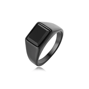 Macro shot of minimalist black titanium steel ring with rectangular black gemstone inlay