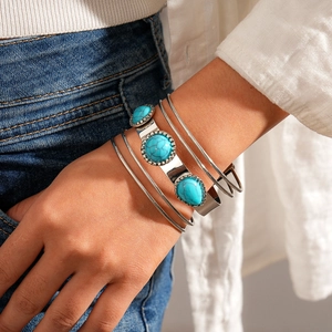 Bohemian silver multi-layer metal bangle set with turquoise stones worn on hand