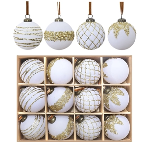 Set of 12 white Christmas baubles with gold glitter patterns in a rustic wooden gift box