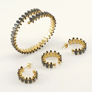 Adjustable gold stainless steel jewelry set with black stones including bracelet ring earrings