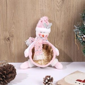 Close-up of pink Christmas candy basket with plush snowman and sparkling sequin hat