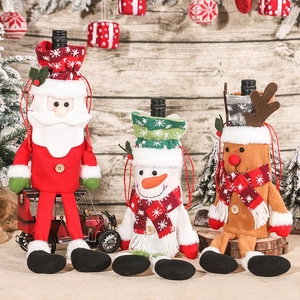 Three-piece Christmas wine bottle covers featuring Santa, Snowman and Reindeer characters