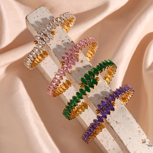Detail of luxury gold bracelets featuring marquise-cut zircons in four elegant colors