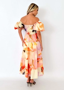 Rear view of off-shoulder floral midi dress with tiered skirt and smocked elastic back detail