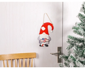 Detail of wooden Santa door sign with American flag heart hanging on white door