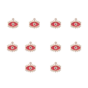 Detailed view of ten gold-plated red devil eye charms with inlaid sparkling rhinestones