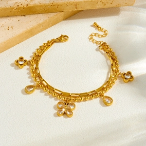 Double-layered gold stainless steel bracelet with butterfly and water drop zirconia charms