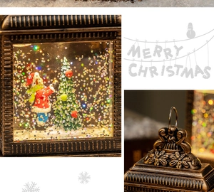 Detail of bronze retro Christmas lantern with embossed floral patterns and internal snow globe