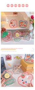 Detailed macro view of clear acrylic pen holders featuring cute cartoon bear and bunny patterns