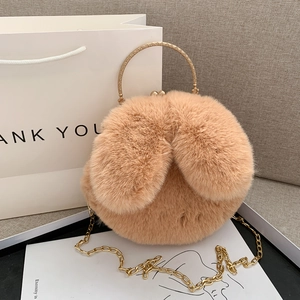 Cute plush handbag with rabbit ears, golden metal handle and chain in light brown color
