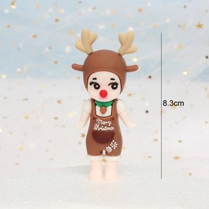 Detail showing 8.3cm cute reindeer doll cake topper with Merry Christmas text for holidays