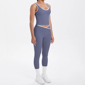 Detail view of high waist V-cross leggings and color-block crop top in misty blue