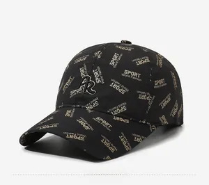 Detail of black baseball cap with golden SPORT print and 3D AR embroidery logo