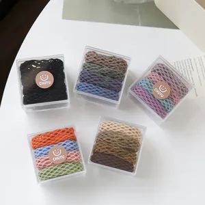 Detailed set of five mesh texture elastic hair ties in neutral Morandi color palettes