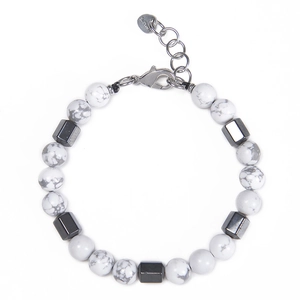 Close-up of 8mm white turquoise beads with stainless steel lobster clasp and heart tag