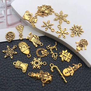 Set of 17 vintage gold Christmas charms including snowflakes and reindeer for DIY jewelry