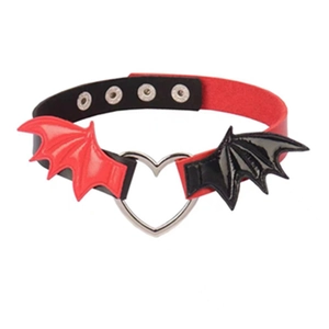 Detail of punk choker with red and black leather wings and silver heart ring