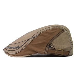 Close-up of vintage cotton beret featuring khaki patchwork and Fashion embroidery